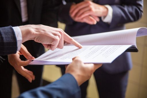 Hands pointing content on a sheet of paper